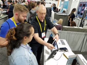 Local company OIO (from Powell) with their iPad speaker case "Amp"; Greg Davis (OIO) with Ryan McManus and Hoa-Lisa Pyles McManus (ContentVia)